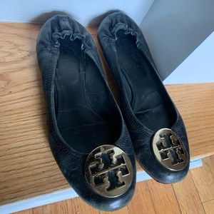 Used black and gold authentic Tory Burch slip on shoes.